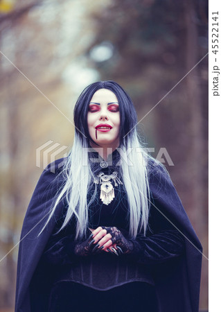 Image of vampire woman with eyes closed with blood at mouth 45522141