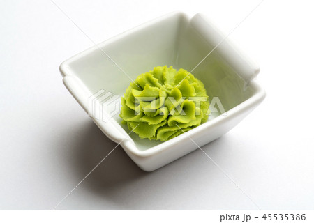 Portion of wasabi in a white gravy boat. 45535386