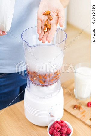 Preparing detox fruits smoothie in blender 45535498