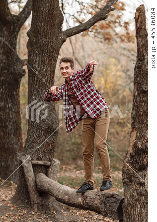 Handsome young guy in nature on an autumn day Handsome young guy in nature on an autumn day 45536084
