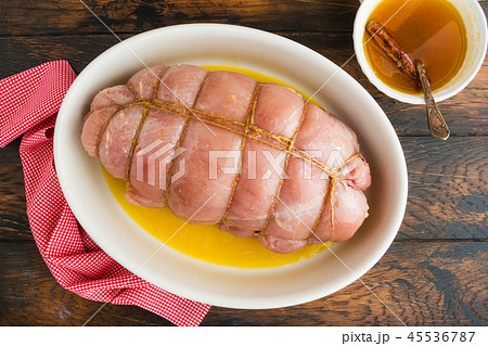 Raw stuffed turkey breast fillet and sauce 45536787