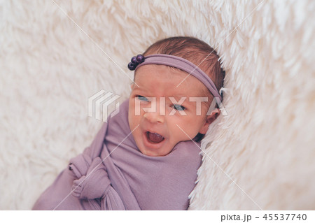 the face of a schild with a bandage on his head 45537740