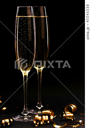 Two glasses of champagne full size on black background. Two glasses of champagne full size on black background. 45543339
