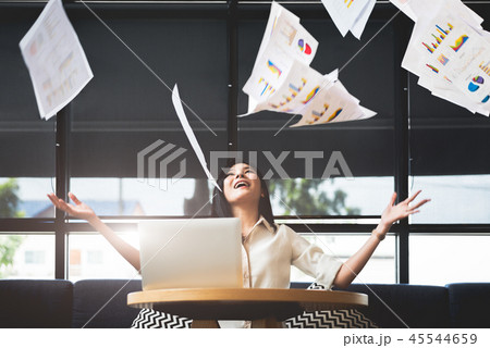 Asian businesswoman throwing paperwork into the air. Successful 45544659