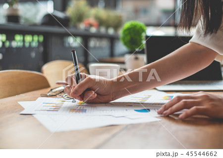 Close up of businesswoman hand writing summary report data. Mark Close up of businesswoman hand writing summary report data. Mark 45544662