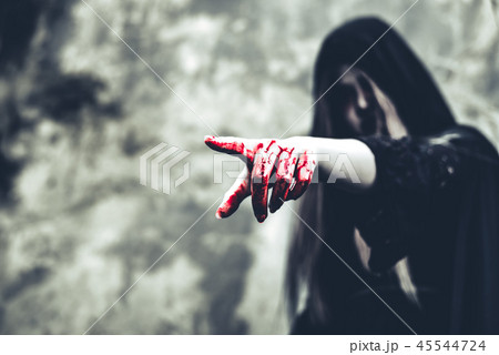 Close up of bloody ghost hand pointing to the front. Horror and 45544724
