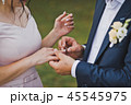 The gentle embrace of the newlyweds palms 1827. 45545975