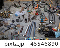 Old metal wrench, key, pliers lying on the asphalts at flea market in Kiev, Ukraine 45546890