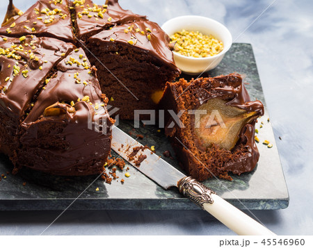 Dark Chocolate cake with pears and pistachio 45546960