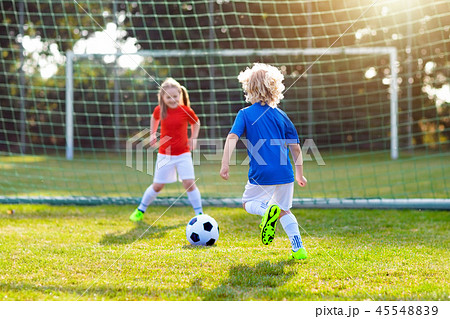 Kids play football. Child at soccer field. Kids play football. Child at soccer field. 45548839