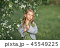 Portrait of a little girl in spring in flowering  45549225
