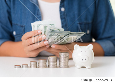 Woman hand counting America dollars banknotes Woman hand counting America dollars banknotes 45552913