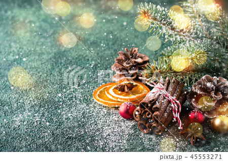 Christmas natural holiday composition with cinnamon, pine cones and dry oranges 45553271
