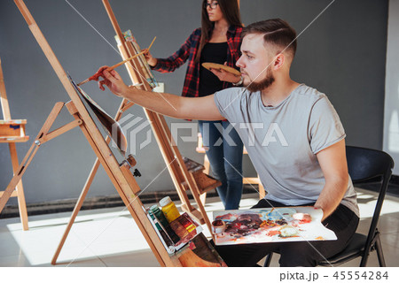 Creative artists have designed a colorful picture painted on canvas with oil paints in the studio 45554284