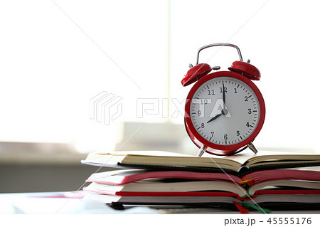 Red alarm clock set at eight in the morning Red alarm clock set at eight in the morning 45555176