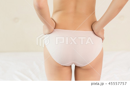 Girl buttocks on white background Girl buttocks on white background 45557757