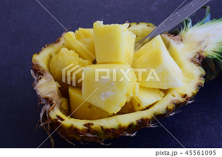 Pineapple cubes in its own pineapple bowl 45561095