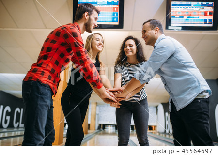 Bowling team joined hands before the competition 45564697
