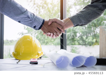 Shaking hands of collaboration, Construction engineering or arch 45569113