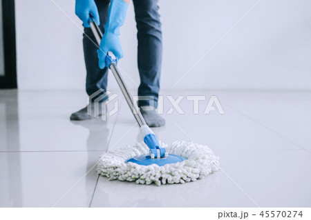 Husband housekeeping and cleaning concept, Happy young man in bl 45570274