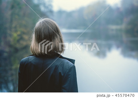 The girl looks into the distance 45570470