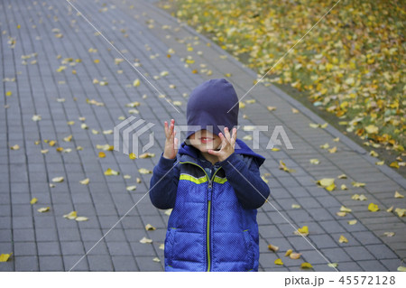 Image of cute baby boy with hat on his eyes, closeup portrait of adorable child, sweet toddler with 45572128