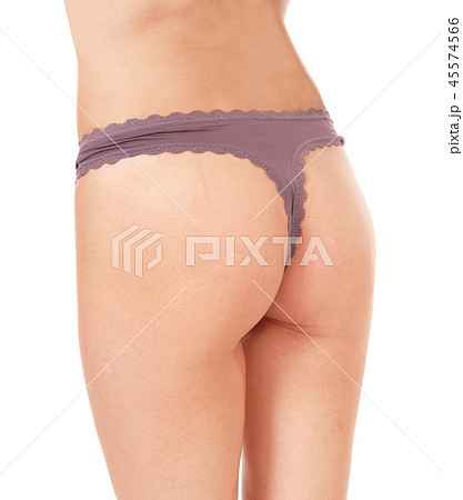 The bottom of a young woman wearing a thong The bottom of a young woman wearing a thong 45574566
