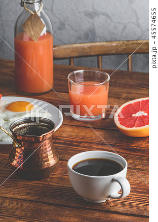 Breakfast with coffee and fried eggs Breakfast with coffee and fried eggs 45574655