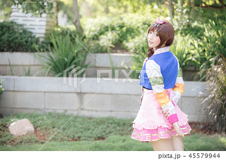 Portrait of Hanbok costume young woman looking and smile in korean park 45579944