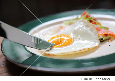 Zucchini fritters with egg on wood background vinage style 45580591