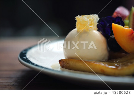 Dessert baked Waffle with fruits kiwo grape berry and vanilla ice cream vintage style 45580628