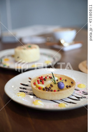 Lemon tart pie topping with chocolate ball sweet dessert on wood background Lemon tart pie topping with chocolate ball sweet dessert on wood background 45580811