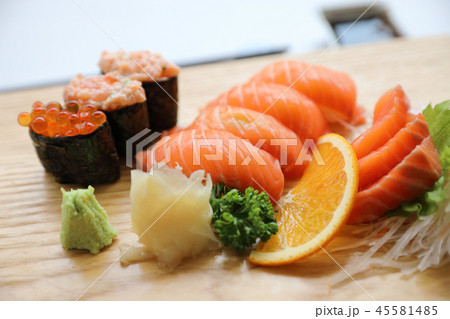 Salmon sushi and sashimi on wood plate Japanese food Salmon sushi and sashimi on wood plate Japanese food 45581485