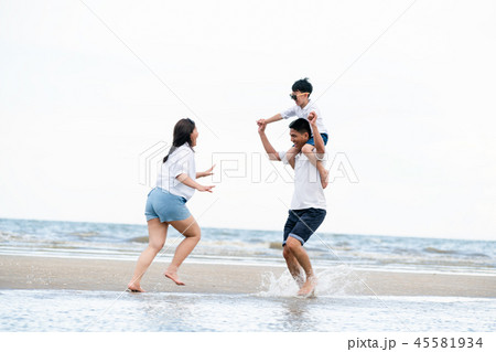 Happy family goes vacation on the beach in summer. Happy family goes vacation on the beach in summer. 45581934