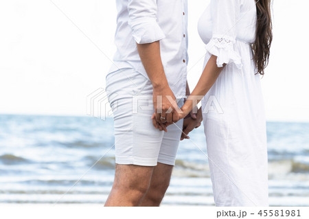 Couple going honeymoon on tropical beach in summer Couple going honeymoon on tropical beach in summer 45581981