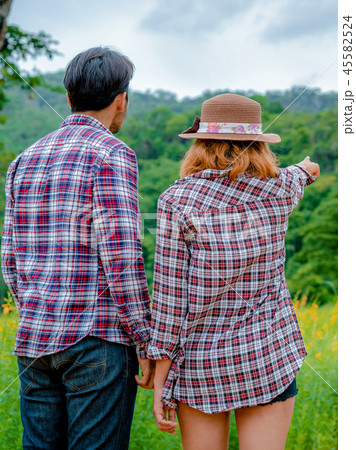 Happy couple take a romantic walk on the hills. Happy couple take a romantic walk on the hills. 45582524