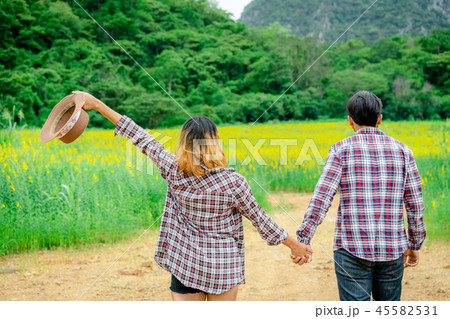 Happy couple take a romantic walk on the hills. Happy couple take a romantic walk on the hills. 45582531