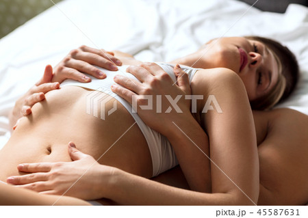 Passionate couple making love in bed. Passionate couple making love in bed. 45587631
