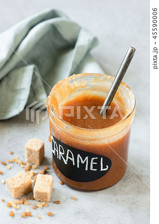 Homemade caramel sauce in jar 45590006
