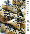 Cutted lavash pieces with vegetables. Burek with spinach and cheese and black cumin. Yufka 45590051