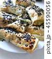 Cutted lavash pieces with vegetables. Burek with spinach and cheese and black cumin. Yufka 45590056