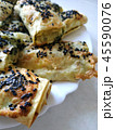 Cutted lavash pieces with vegetables. Burek with spinach and cheese and black cumin. Yufka 45590076