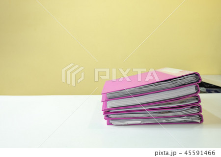Stack of account file documents on white desk Stack of account file documents on white desk 45591466