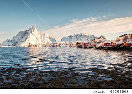 Scandinavian fishing village with snowy mountain Scandinavian fishing village with snowy mountain 45591663
