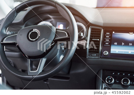 Luxury car Interior - steering wheel, shift lever, dashboard and computer. 45592002