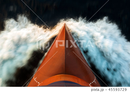 Red color bulb of the cargo ship underway at sea. 45593729