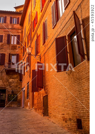 Street view in Siena, Italy with medeival houses 45593922