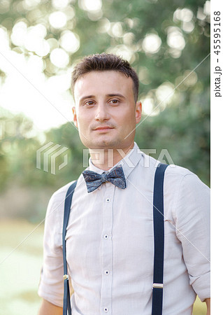 Portrait of a young handsome groom outdoors. Portrait of a young handsome groom outdoors. 45595168