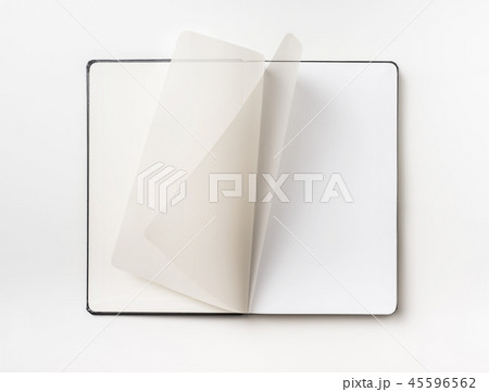 Top view of black notebook with curl rolled page 45596562