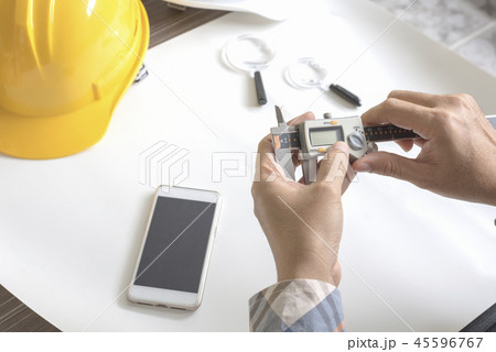 Construction engineer measuring with vernier Construction engineer measuring with vernier 45596767
